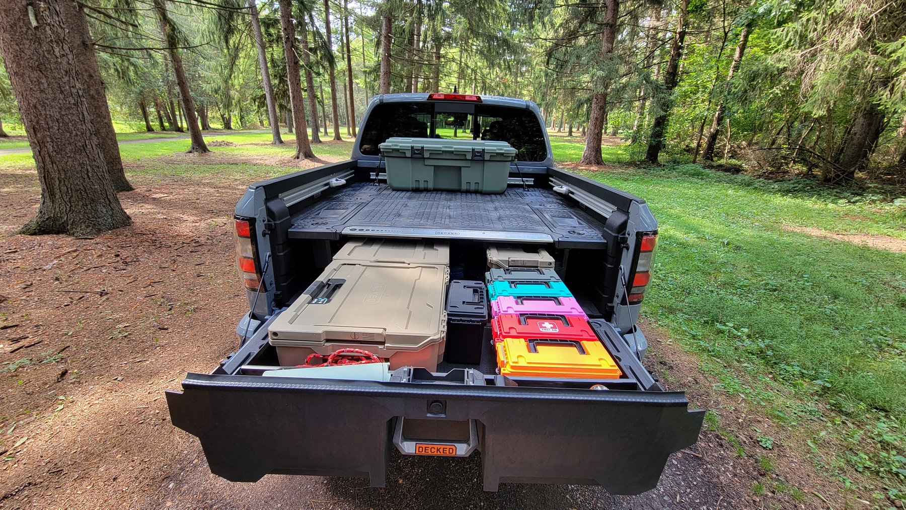 Figure 2 — The same system with a drawer out, holding the loose kit that was weighed at 49.7 lb: tool cases, the med kit, tie-downs, shovel and axe. This is the pile that had been double-counted in…